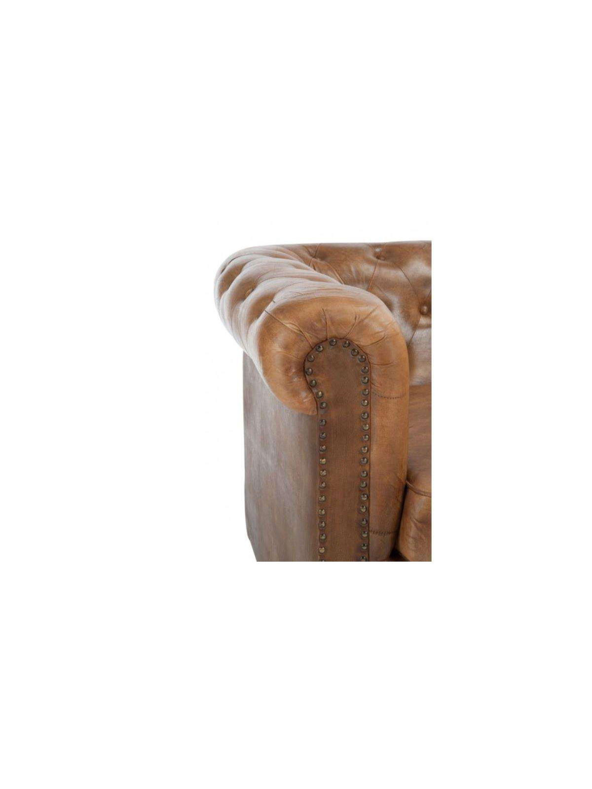 Fauteuil Chesterfield cuir capitonné